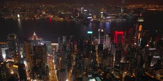 夜景照亮香港市区维多利亚港市区4k空中全景