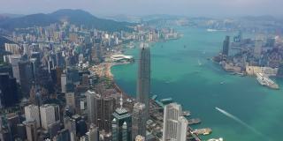 阳光明媚的白天飞越香港市区维多利亚港交通全景4k