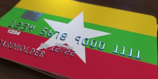 带有缅甸国旗的银行卡。缅甸国家银行系统相关动漫