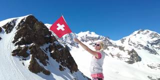 Diavolezza上的女孩与瑞士国旗慢动作