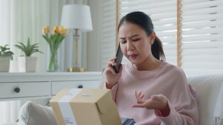亚洲女子不满客户不满送货电话投诉。视频素材模板下载