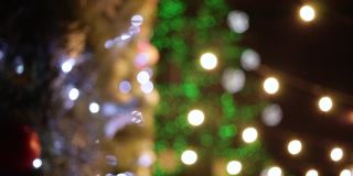 12月，新年，圣诞节。模糊的背景。圣诞树，花环，散景，彩灯。节日气氛,屏幕保护程序。闪光