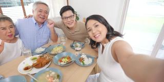 4K幸福的亚洲家庭在家里聚餐