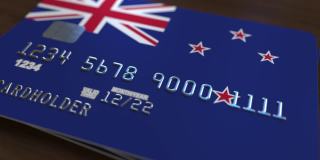 带有新西兰国旗的塑料银行卡。国家银行系统相关动画