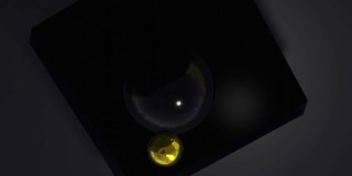 金色液体倒在黑色球形物体上