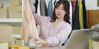 POV亚洲女性网红卖家直播销售服装，进行网络社交营销