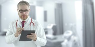 专注的医生在病房的平板电脑上填写清单。用红色相机拍摄