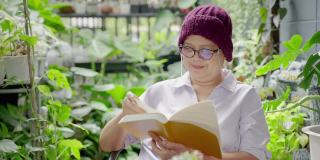亚洲老年癌症阅读书籍，在花园放松，健康理念，健康保险，人寿保险