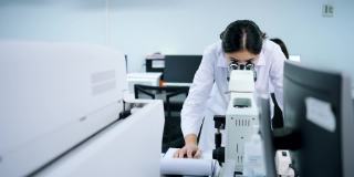 实验室技术员，亚洲医疗技术人员在私人实验室工作。