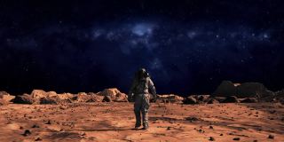 下面的照片，勇敢的宇航员穿着宇航服自信地行走在火星表面，走向银河，覆盖着岩石。第一个登上火星的宇航员。先进技术，太空探索/旅行，殖民概念。