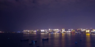 夜晚照明三亚城市湾屋顶全景，4k时间推移海南岛中国