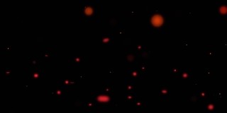 动画发光的红色粒子移动在黑色的背景