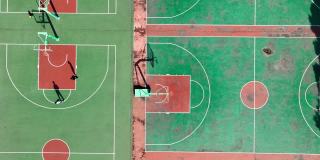无人机航拍人们在阳光明媚的日子一起打篮球