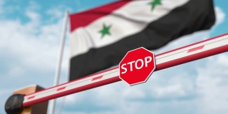 关闭的栅门上叙利亚国旗的背景