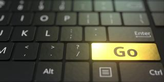 黑色的电脑键盘和金色的go键