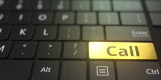 黑色电脑键盘和金色呼叫键