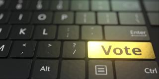 黑色的电脑键盘和金色的投票键