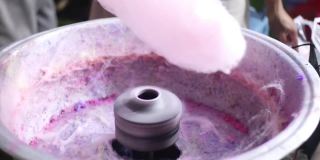 全高清视频制作棉花糖的过程，以糖和粉红色食用色素为主要成分，棉花糖机