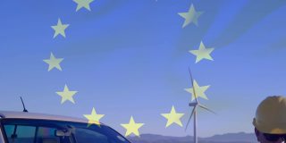 动画欧盟旗帜在工程师使用平板电脑和风力涡轮机在现场