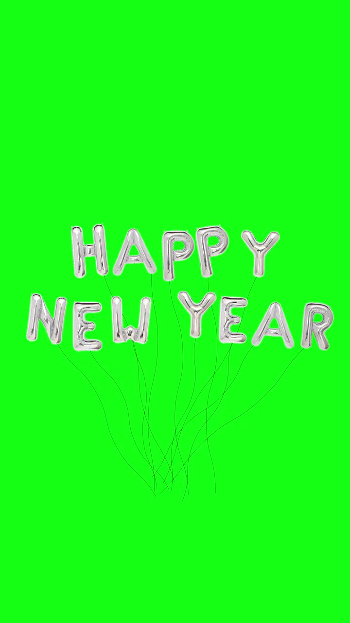 2022年新年快乐定格动画金银气球动画概念。快速介绍和走出与文本信息或标志的复制空间，孤立在绿色屏幕背景。