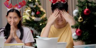 圣诞节期间，亚洲孩子们在家里拍摄饼干烹饪视频制作病毒视频，或者在家里一起拍TikTok，这是新一代概念的时尚生活方式。