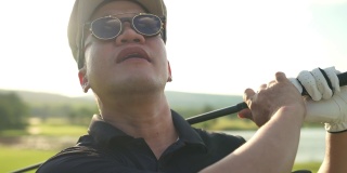 亚洲男子高尔夫球手在夏天阳光灿烂的一天高尔夫球场高尔夫的4K肖像。