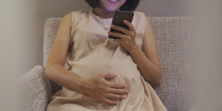 亚洲孕妇使用智能手机