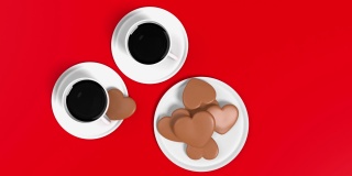 心形饼干和两个咖啡杯对红色背景在4K分辨率