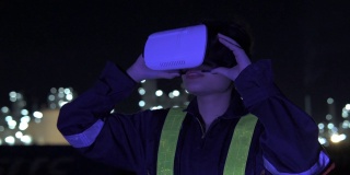 亚洲女工程师戴着虚拟现实耳机的石油和天然气或其他工业场所。