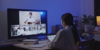 年轻的亚洲妇女使用笔记本电脑学习财务顾问通过网络会议与各种业务人员工作到深夜