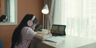 亚洲女孩在家通过视频学习