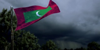 在黑暗的风暴积云上挥舞马尔代夫国旗作为国家假日