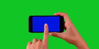 4k手使用智能手机在绿色屏幕上显示色度键