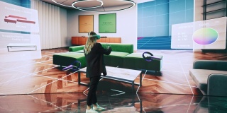 室内设计师使用VR软件设计生活空间。改变沙发的颜色，在互动环境中在大数字屏幕上移动家具。女工程师使用耳机和控制器。