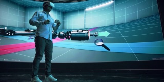 汽车工程师使用虚拟现实软件在大数字屏幕上展示互动环境中的电动马达和车辆平台。使用耳机和控制器的多种族男性工程师。