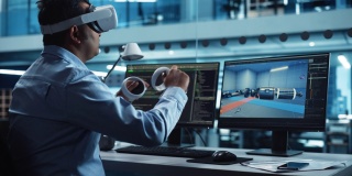 汽车工程师使用VR软件在一个工厂办公室的交互式环境中工作电动马达和车辆平台。工业工程师使用耳机和控制器。