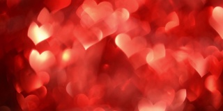 4k情人节背景。红红的心在运动中闪闪发光。