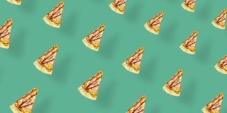 披萨的彩色图案孤立在绿色背景与阴影。披萨切片的无缝图案。前视图。现实的动画。4 k视频运动