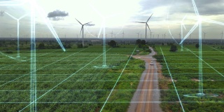 风力发电的鸟瞰图与绿色能源产生的运动图形概念。未来科技的数码效果。