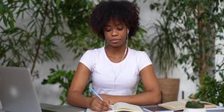 重点关注非洲女大学生学习科目，备考做笔记写论文，使用笔记本电脑，阅读纸质书。