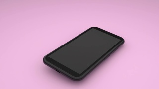 一部黑色的智能手机掉在粉色的桌面上，弹起来不会摔坏视频素材模板下载