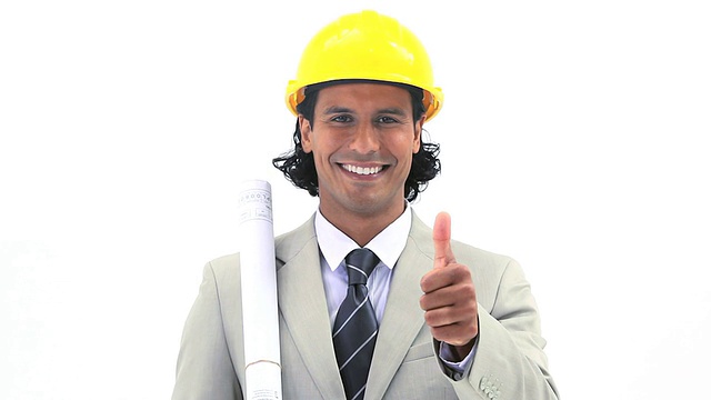 Smiling worker holding blueprints