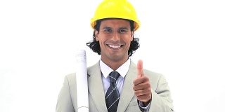 Smiling worker holding blueprints