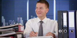 Businessman receiving letters and smiling