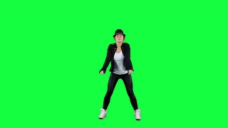 戴着帽子的女孩像流行音乐之王一样跳舞。色度键背景视频素材模板下载