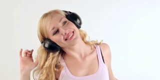 Girl with headphones dancing
