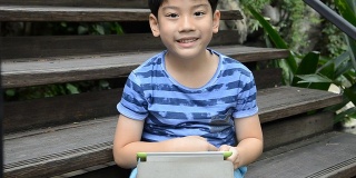 Young Asian child using a digital tablet