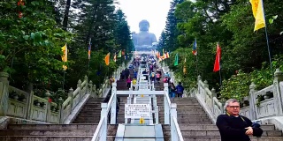 People Walking Up High Stairway to the昂坪佛