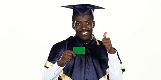 Graduate holding a green card. White. Close up