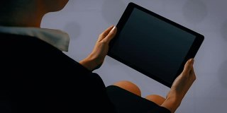 Businesswoman using tablet with digital animation